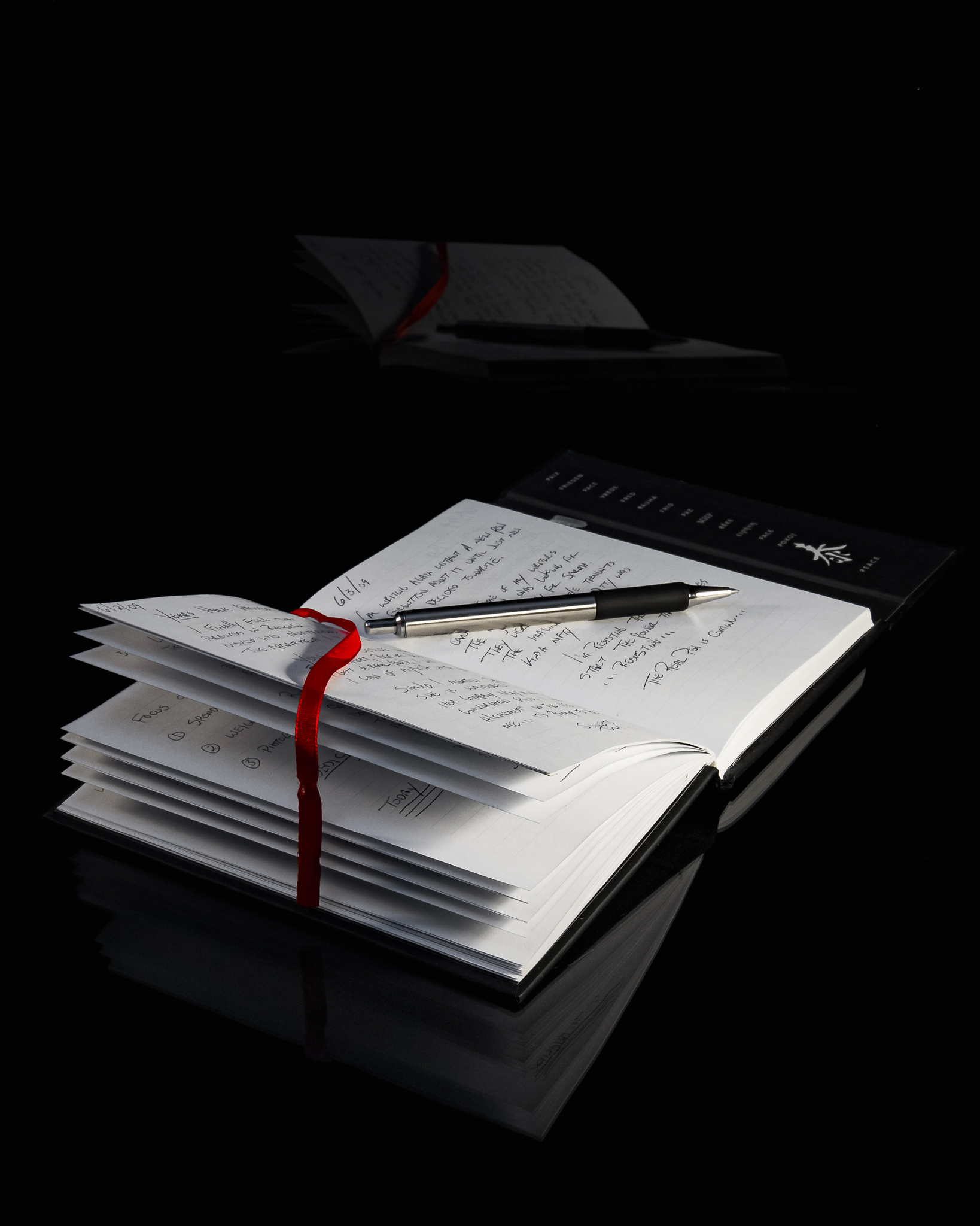 An open journal surrounded by its reflection